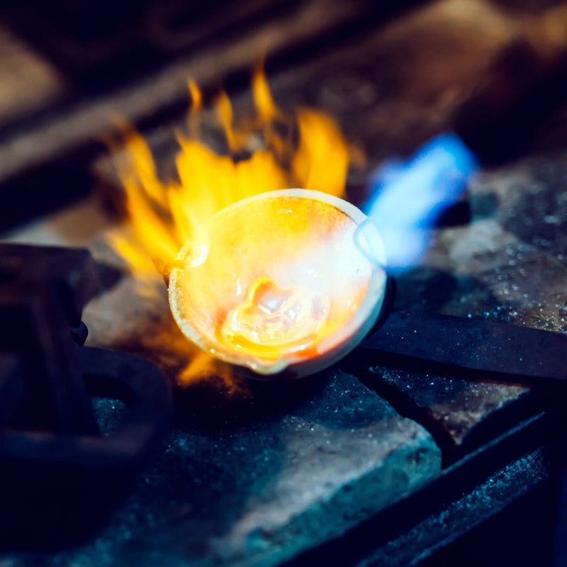 melting old jewellery at a forge