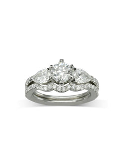 Claw Round and Pear Shaped Diamond Trilogy Ring Ring Pruden and Smith Engagement Ring with one fitted band  